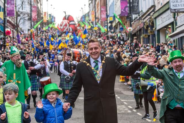 Mayor Graham Warke leads the annual St. Patrick's Day Spring Carnival through Derry city centre for the first time in two years. Picture Martin McKeown. 17.03.22