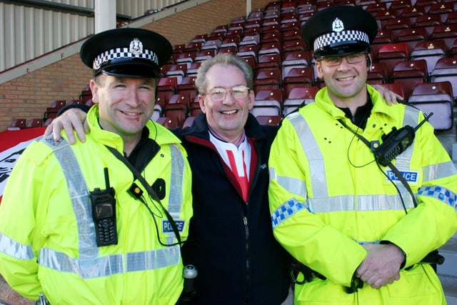 Derry City FC fan with the local constabulary.