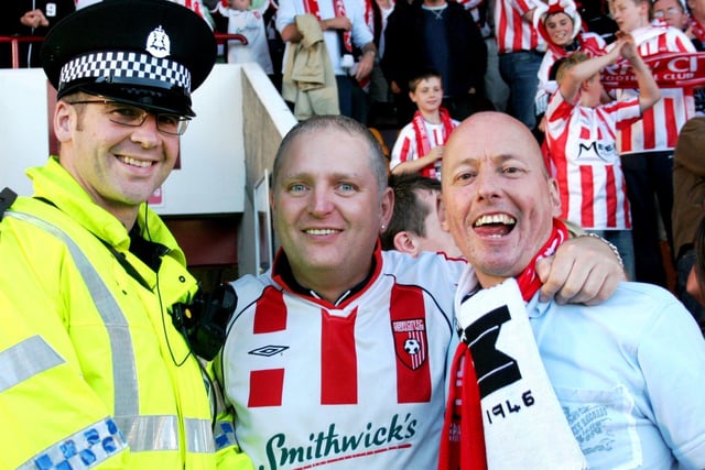 Derry fans with a Gretna policeman.