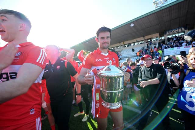 Derry captain Chrissy McKaigue keeps a tight hold on the Anglo Celt Cup in Clones on Sunday. (Photo: Ulster GAA)