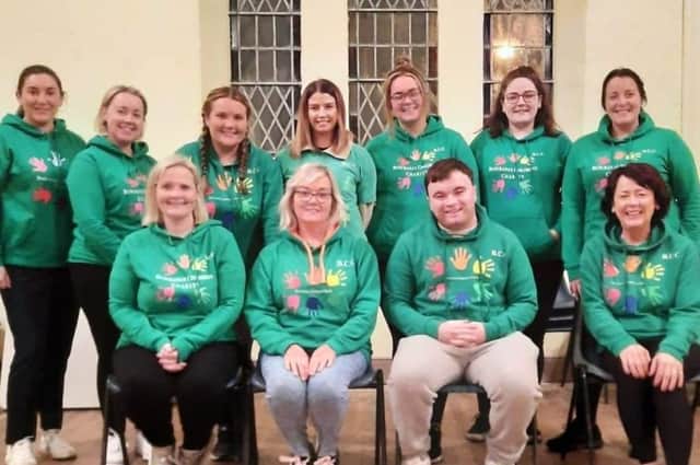 Adrian McMyler (third from front) pictured with the Buncrana Children's Charity committee.