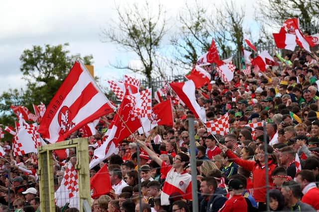 Derry fans keep the flag flying during Sunday's Ulster senior football Championship final in Clones. (Photo: Ulster GAA)