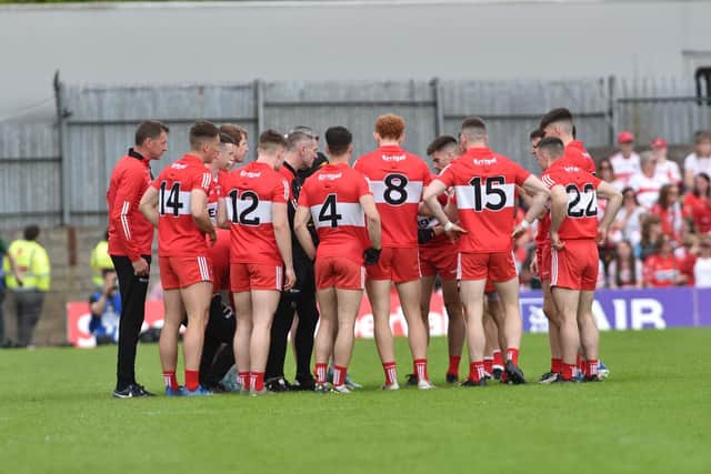 Derry manager Rory Gallagher hands out last minute instruction to his team before Sunday's Ulster Championship Final. (Photo: Ulster GAA)
