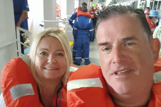 Pam and Martin Mullan with life jackets on in the middle of the emergency