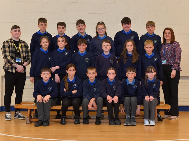 Miss McCaul and Mr Kelly, teaching assistant with their P7 class at St Therese’s Primary School. DER222GS – 012