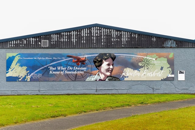A mural commemorating the 90th Anniversary of the landing of Amelia Earhart in Derry on the gable wall of the Eurospar (Gallaigh Co-Op) painted by local artist Joseph Campbell.  The art work was Commissioned by Community Restorative Justice North West (CRJ-NW) and funded by Derry and Strabane District Council's Good Relations Programme. Photo: George Sweeney.  DER2220GS – 061