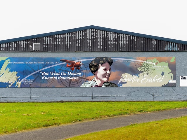 A mural commemorating the 90th Anniversary of the landing of Amelia Earhart in Derry on the gable wall of the Eurospar (Gallaigh Co-Op) painted by local artist Joseph Campbell. The art work was Commissioned by Community Restorative Justice North West (CRJ-NW) and funded by Derry and Strabane District Council's Good Relations Programme. Photo: George Sweeney. DER2220GS – 061