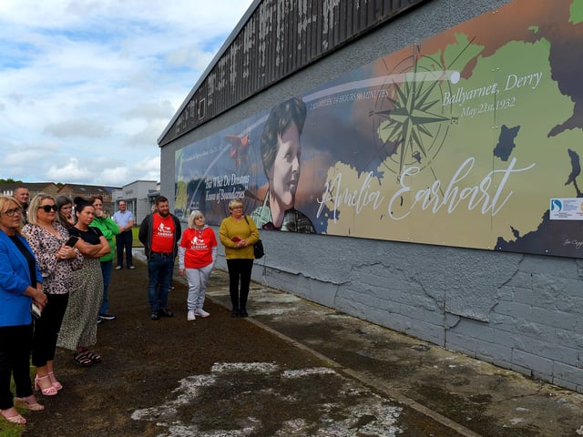 Some of the attendance at the unveiling of a mural commemorating the 90th Anniversary of the landing of Amelia Earhart in Derry on the gable wall of the Eurospar ( Gallaigh Co-Op) on Friday afternoon last. Photo: George Sweeney. DER2220GS – 063
