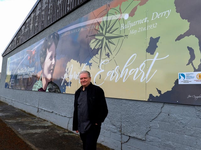 Pictured at the unveiling of a mural commemorating the 90th Anniversary of the landing of Amelia Earhart in Derry on the gable wall of the Galliagh Co-Op on Friday afternoon last is creater of the artwork Derry artist Joseph Campbell. The digital print created from Joseph’s original artwork spans 48ft wide and 8ft high. Photo: George Sweeney. DER2220GS – 066
