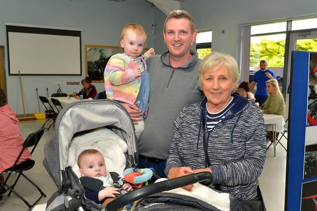 Eoin and Meabh Lavery pictured with their dad Dermott and grandmother Sally at the Galliagh Neighbourhood Lunch held in the new Galliagh Community Centre on Friday afternoon last. Photo: George Sweeney. DER2220GS – 072