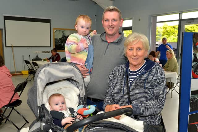 Eoin and Meabh Lavery pictured with their dad Dermott and grandmother Sally at the Galliagh Neighbourhood Lunch held in the new Galliagh Community Centre on Friday afternoon last. Photo: George Sweeney.  DER2220GS – 072