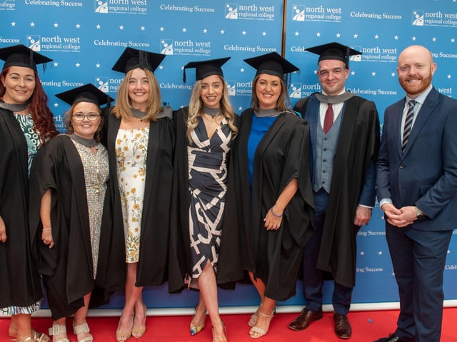 Group of graduates from NWRC celebrate with MC Barra Best.