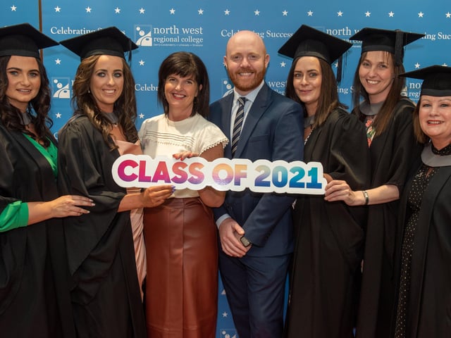 Graduation group celebrating with Barra Best at NWRC's graduation ceremony in the Millennium Forum.