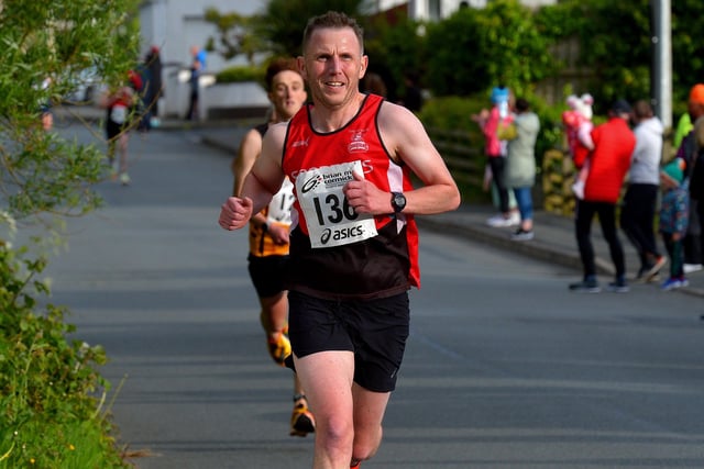 Mark Mullan, City of Derry Spartans, yards from the finish line, of the Furey Insurance Buncrana 5Km, in Lower Main Street on Wednesday evening last. Photo: George Sweeney.  DER2222GS – 050