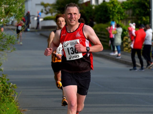 Mark Mullan, City of Derry Spartans, yards from the finish line, of the Furey Insurance Buncrana 5Km, in Lower Main Street on Wednesday evening last. Photo: George Sweeney. DER2222GS – 050