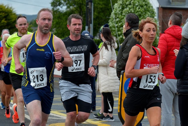 Jacqueline MacMonagle (153), City of Derry Spartans, makes her way along Railway Road during the Furey Insurance Buncrana 5Km on Wednesday evening last. Photo: George Sweeney.  DER2222GS – 044
