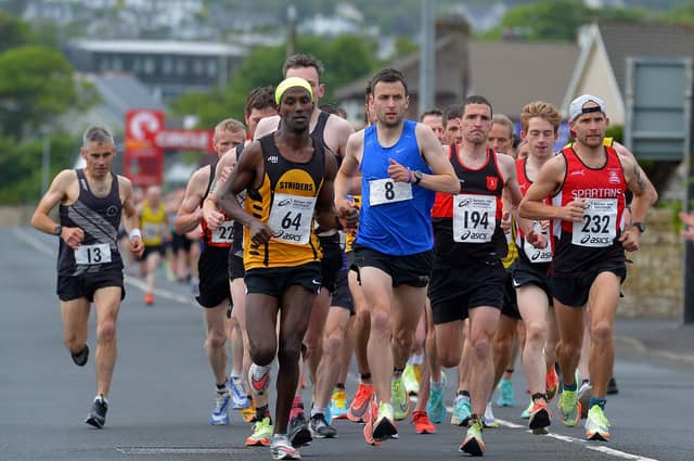 Eskander Turki (64) Annadale Striders, who finished second, race winner John Paul Williamson (8) unattached and City of Derry Spartans’ Kyle Doherty (232), who finished fifth, lead the pack along Railway Road during the Furey Insurance Buncrana 5Km on Wednesday evening last. Photo: George Sweeney. DER2222GS – 041