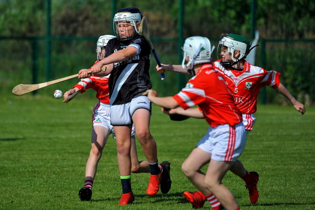 Kevin Lynchs’ take on Loughgiel Shamrocks during the Seán Mellon Hurling Festival at Páirc Na Magha on Saturday. Photo: George Sweeney.  DER2223GS – 135