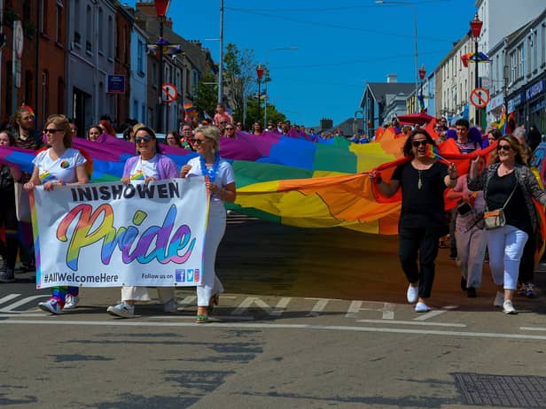 The colourful Inishowen Pride Parade makes it way along Lower Main Street in Buncrana on Sunday afternoon last. Photograph: George Sweeney. DER2224GS – 022