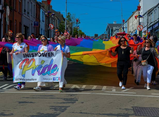 The colourful Inishowen Pride Parade makes it way along Lower Main Street in Buncrana on Sunday afternoon last. Photograph: George Sweeney. DER2224GS – 022