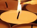 Lighting candles.