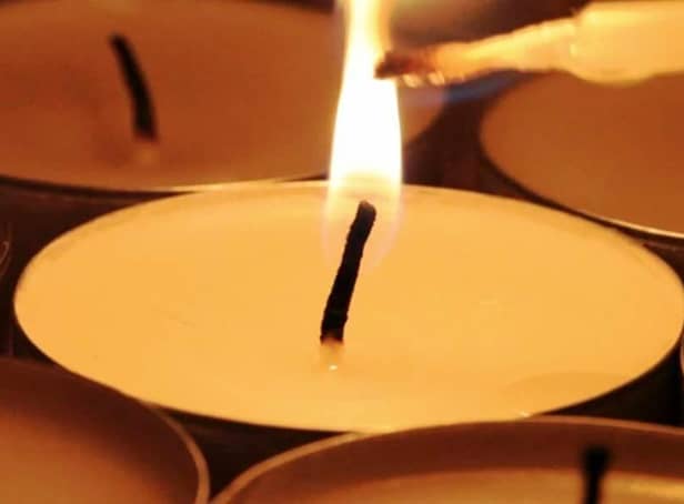 Lighting candles.