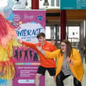 Mascot Shannon Peake jumps in the air with Ronan Tester, joint chair and Mags Anderson, Education & Schools Marketing Officer at the Millennium Forum pictured at the launch of the INTERACT Youth Arts Festival 2022 in the Millennium Forum. Picture Martin McKeown. 07.06.22