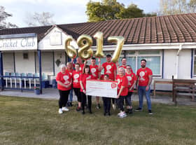 Amanda Ross and family presenting their Red Dress Fun Run fundraising cheque to Mona Duddy, NICHS Care Services Co-ordinator.