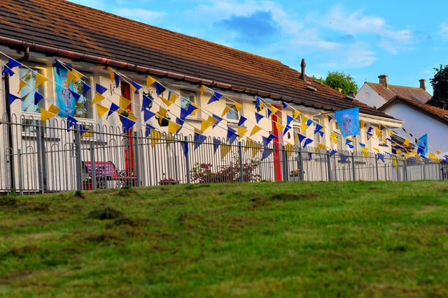 Bungalows in The Wells draped in buntings, the colours of the Ukrainian flag, during ‘An Turas – The Journey’ celebratory pageant on the life and legacy of Saint Colmcille held in the Bogside, on Thursday evening last. Photograph: George Sweeney. DER2224GS – 038