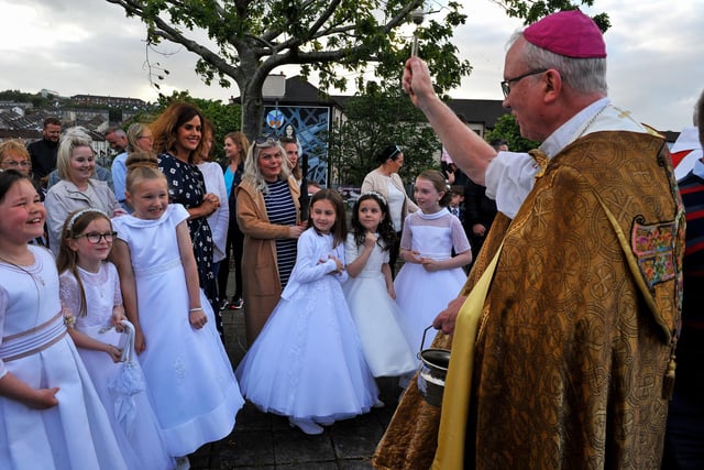 Children who recently made their First Communion blessed by The Most Reverend Dr Donal McKeown, Bishop of Derry, during the traditional Saint Colmcille Feast Day Blessing at St Columba’s Well in the Bogside, on Thursday evening last. Photograph: George Sweeney. DER2224GS – 035