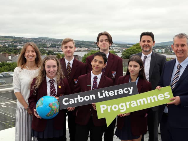 Pictured (l-r) are teacher Nicole Sloane, students Ellie Rankin, Andrew Logan, Anas Mohammad, James Daniell, and Farrah Foster with Scott Howes from Keep Northern Ireland Beautiful and Minister Poots.