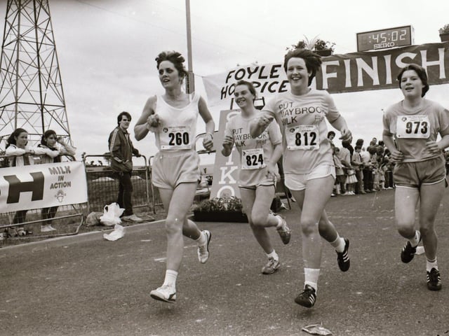 From left: Brigeen Moore, Mary Fleming, Alexander Campbell and Maria Sweeney cross the finish line.