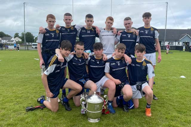 The St. Columb’s College side which finished runners-up in the ‘A’ Section of the Brian Og McKeever Memorial Nines at Pairc Bhrid pictured with the Anglo Celt Cup which was on display at the tournament.