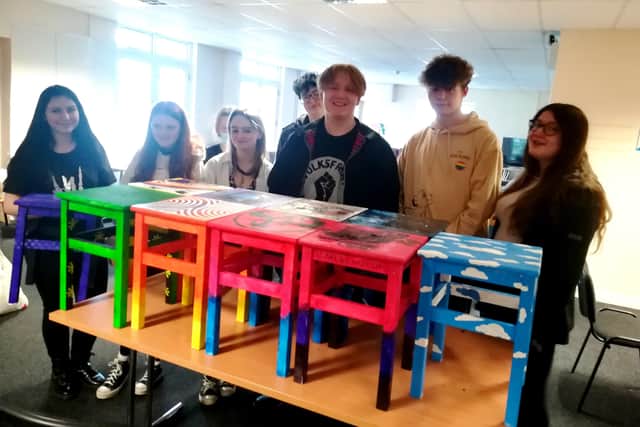 Young people with their 'Take A Seat' stools.