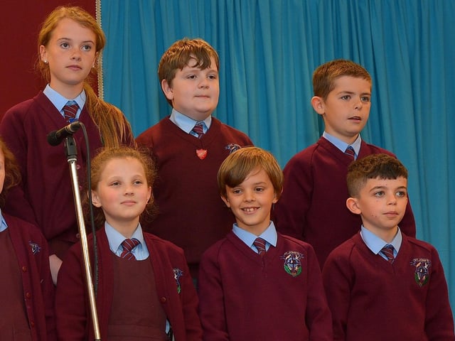 Pupils from P6 perform a sketch at the St Johnâ€TMs Primary School 50th anniversary celebrations held on Friday afternoon last. Photograph: George Sweeney. DER2224GS – 063