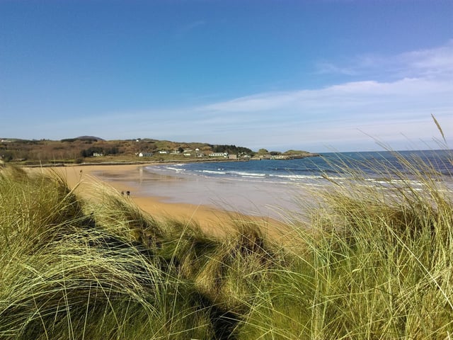 Culdaff Beach in North Inishowen. A beautiful sandy beach with a playground and picnic benches, perfect for sandy crisp sandwiches after a dip.