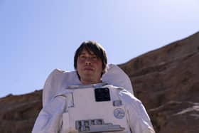 Prof. Brian Cox in a space suit in the desert