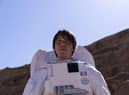 Prof. Brian Cox in a space suit in the desert