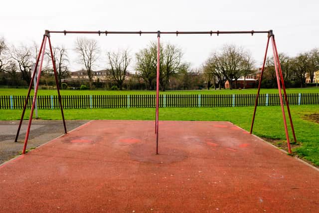 Swing frame with missing swings. Derry City and Strabane District Council are urging parents to be aware of their childrens' whereabouts following an escalation in vandalism and graffiti in Council owned play parks.
