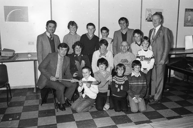 The Na Magha Hurling Club president, Billy Taylor, chatting to young members and parents at a ‘Club Night’ held in Carnhill Parish Centre in June 1982.