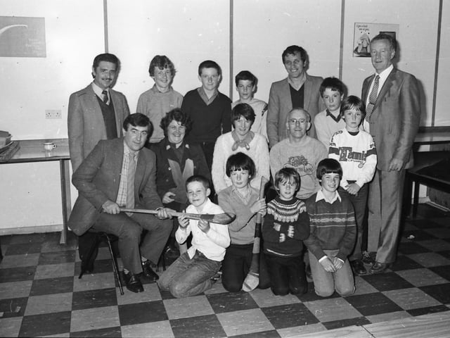 The Na Magha Hurling Club president, Billy Taylor, chatting to young members and parents at a ‘Club Night’ held in Carnhill Parish Centre in June 1982.