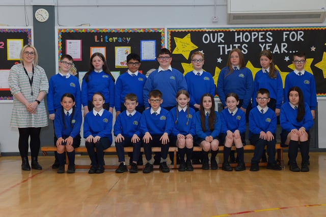 Miss McGinty with her P7 class at St Paul’s Primary School. DER222GS – 010