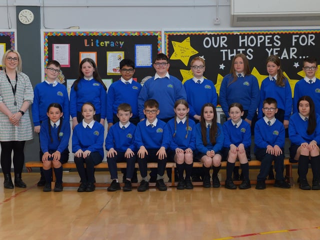 Miss McGinty with her P7 class at St Paul’s Primary School. DER222GS – 010