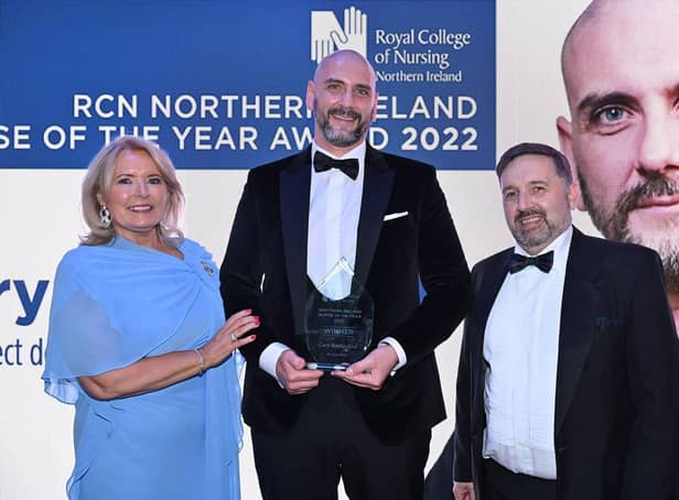 Pictured receiving the RCN Northern Ireland Nurse of the Year Award 2022 is Gary Rutherford (centre) with Pat Cullen, RCN General Secretary and Chief Executive (left) and Health Minister Robin Swann (right).