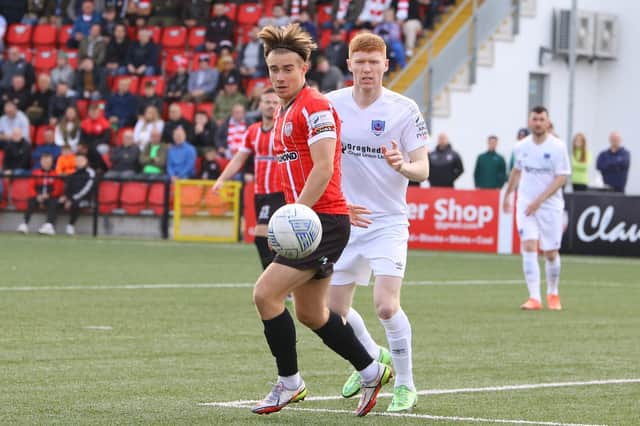 Derry City goalscorer Matty Smith gets to this ball before Drogheda's Darragh Nugent at the Ryan McBride Brandywell. Photographs by Kevin Moore.