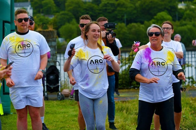 Participants take part in a warm-up before the ARC Fitness Father’s Day Colour Dash held on Sunday afternoon last at Destined, Foyle Road. Photograph: George Sweeney.  DER2226GS – 005