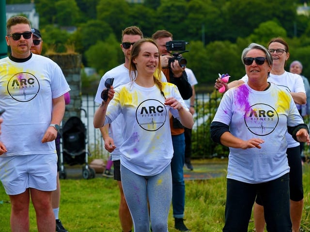 Participants take part in a warm-up before the ARC Fitness Father’s Day Colour Dash held on Sunday afternoon last at Destined, Foyle Road. Photograph: George Sweeney. DER2226GS – 005