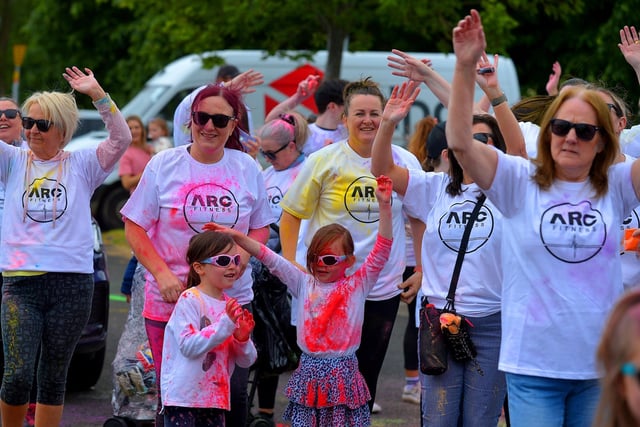Participants take part in a warm-up before the ARC Fitness Father’s Day Colour Dash held on Sunday afternoon last at Destined, Foyle Road. Photograph: George Sweeney.  DER2226GS – 006