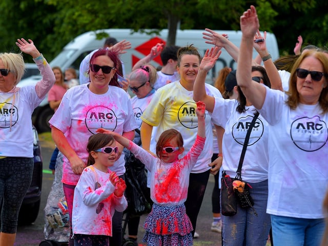 Participants take part in a warm-up before the ARC Fitness Father’s Day Colour Dash held on Sunday afternoon last at Destined, Foyle Road. Photograph: George Sweeney. DER2226GS – 006