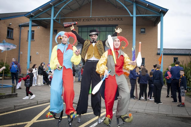 Some of the colourful characters in the grounds of St. Josephâ€TMs Boys School before the start of Fridayâ€TMs parade.